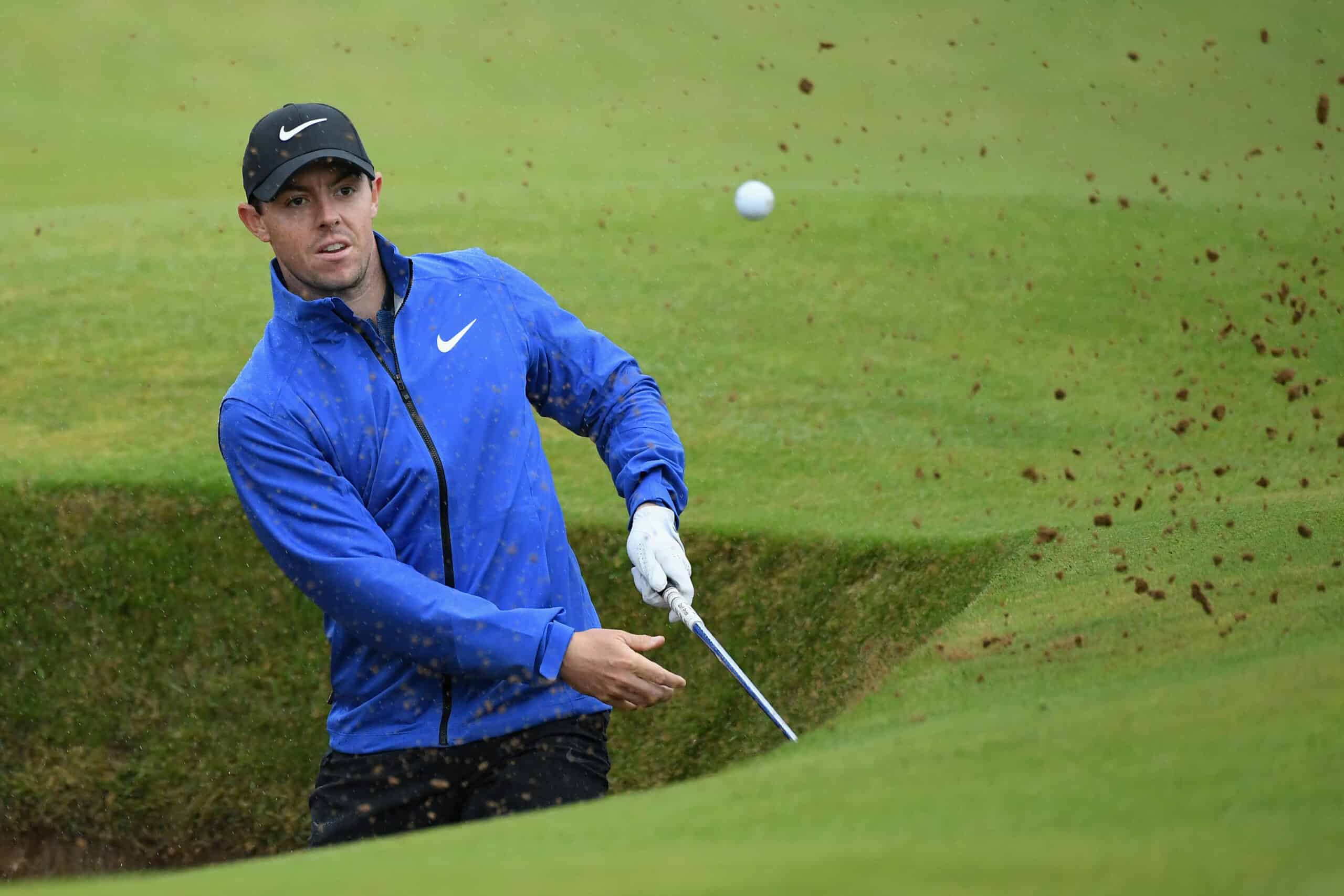 TROON, SCOTLAND - JULY 15: Rory McIlroy of Northern Ireland hits from a bunker on the 12th hole during the second round on day two of the 145th Open Championship at Royal Troon on July 15, 2016 in Troon, Scotland. (Photo by Jan Kruger/R&A/R&A via Getty Images)