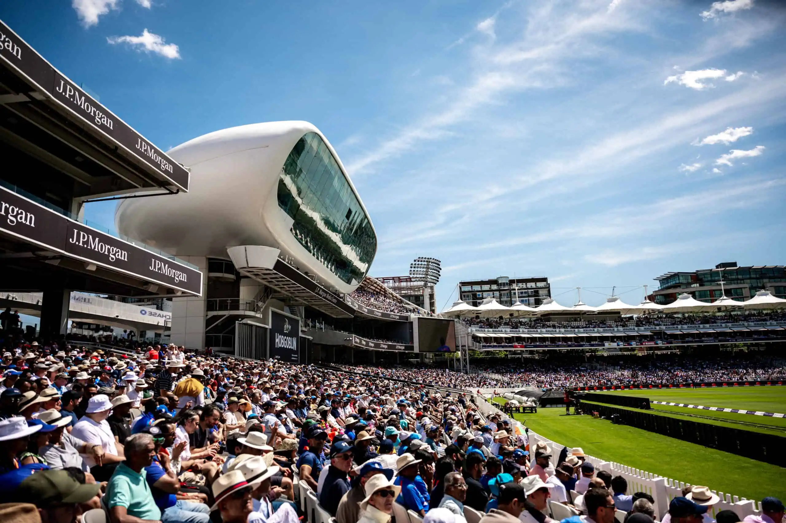 Fans spectate at Lord's Cricket Ground under the media centre