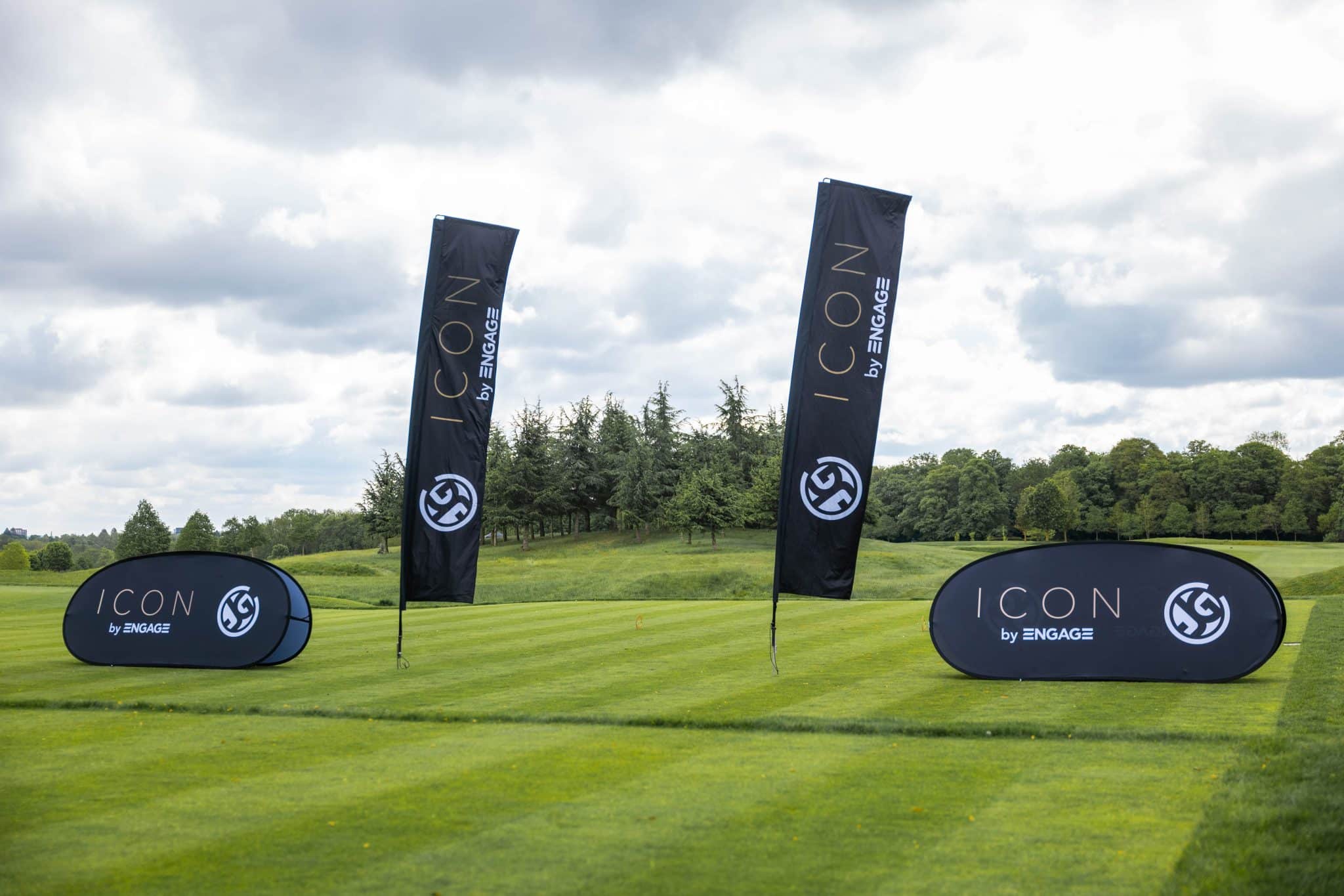 Engage branding banners on a golf course, highlighting the "Partnering with Engage" initiative.